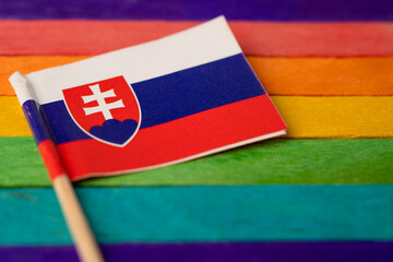 Slovakia flag on rainbow background symbol of LGBT gay pride month  social movement rainbow flag is...