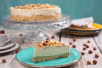 Cheese cake with hazelnuts on wood background