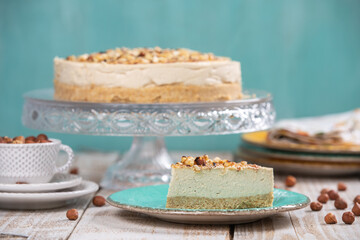 Cheese cake with hazelnuts on wood background