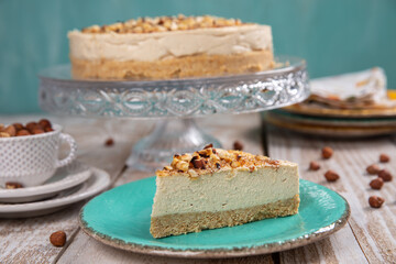Cheese cake with hazelnuts on wood background