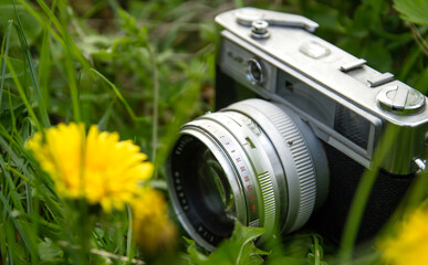 Old photocamera on the grass