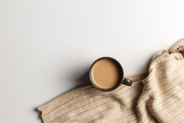 Obraz premium Abstract autumn composition. Colorful background image. Autumn, winter concept. Top view. Flat lay. Copy space. Plaid, cup of coffee on white background. Thanksgiving day concept