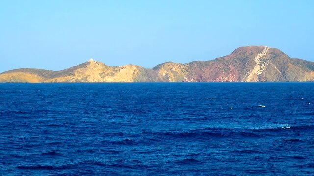 Cruise ship vacation in Greece, greek island view on cruise boat at sea.