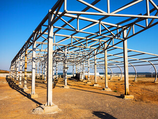 Steel structures on waterfront. Construction of summer cafe on black sea coast in Odessa.