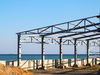 Steel structures on waterfront. Construction of summer cafe on black sea coast in Odessa.