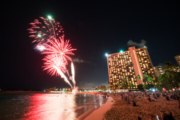 Firework of tropical city at night in Honolulu, Hawaii, USA