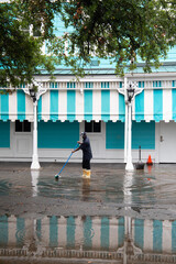 man in a puddle during cyclone season in New Orleans
