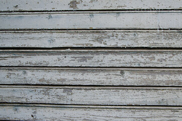 Obraz premium Background of old boards with blue-gray peeling paint