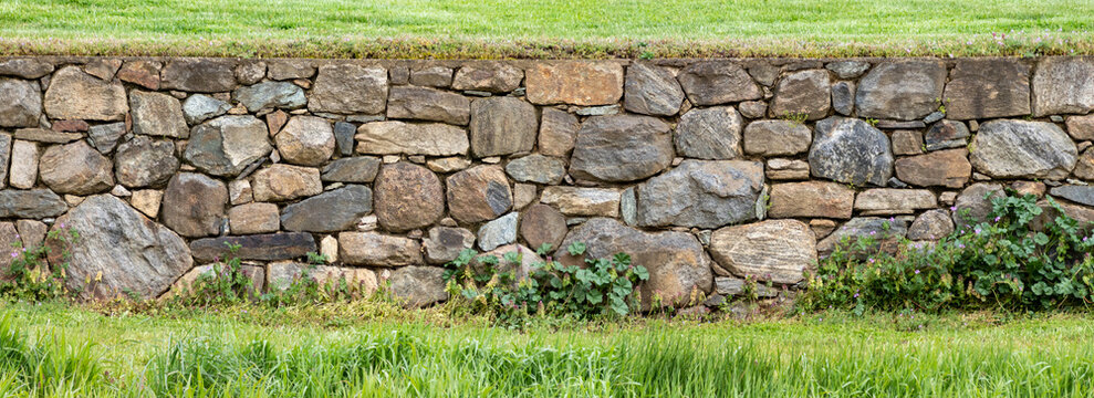 Ultrawide Panoramic Tightly Constructed Beautiful Old Stone Wall in a Field at Stroud Preserve, Chester County, Pennsylvania, USA