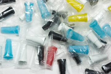 Multicolored disposable mouthpieces for hookah on white background. close-up. accessories for hookah.