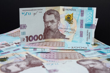 Ukrainian money denomination of one thousand hryvnias, a new Ukrainian banknote on a black...