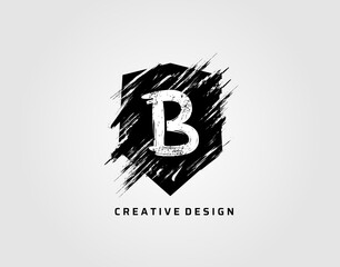 Grunge Shield Icon With Letter B. Rustic Shield Logo. © bintank