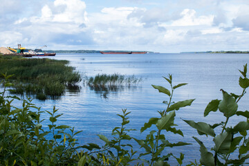 View of the Volga from coast of Rybinsk. Barges and ships