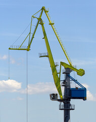 old port crane on background sky