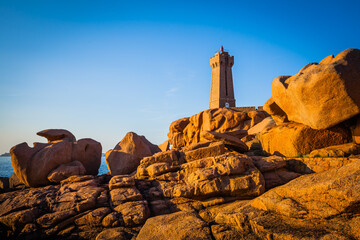 Old lighthouse at the Cote de Granit Rose at the coast of Brittnay, France