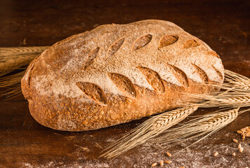 Bread on rustic wooden background.	