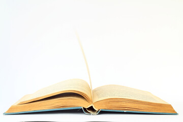 White opened book with blank pages.