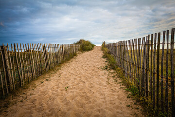 Wooden Fence at a sandy beach in Brittany, France
