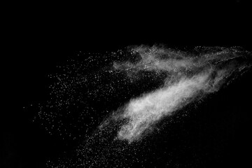 White powder explosion on black background.