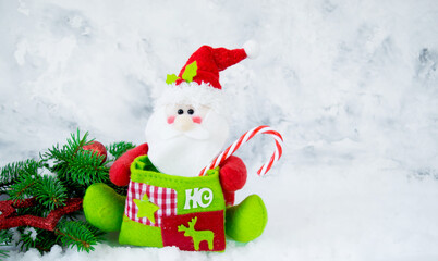 Christmas, new year composition. Santa claus, fir branches, snow on wooden white background. Flat lay, top view. copy space. Concept for New Year, Winter Holidays
