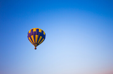 Big balloon flies against the sky