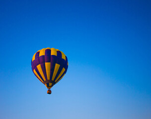 Big balloon flies against the sky