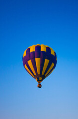 Big balloon flies against the sky