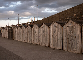 old wooden tiny houses on the beach.