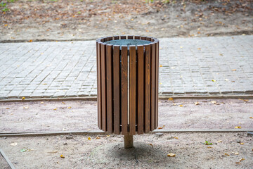 Small street litter bin in a public city park