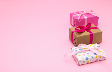 Birthday gifts on pink background 