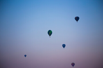 Big balloon flies against the sky