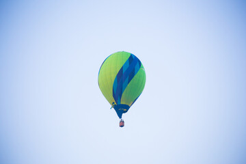 Big balloon flies against the sky