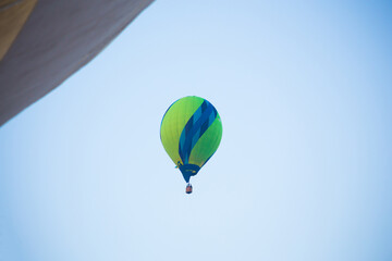 Big balloon flies against the sky