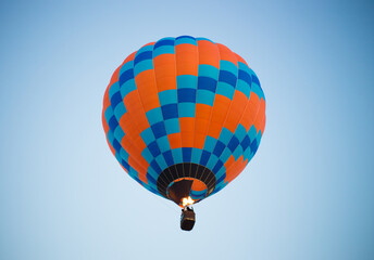Big balloon flies against the sky