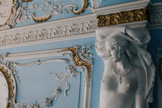 Fragment of ancient decorated palace wall in classicism style, interior design