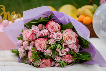 Beautiful large bouquet of roses on a festive background.