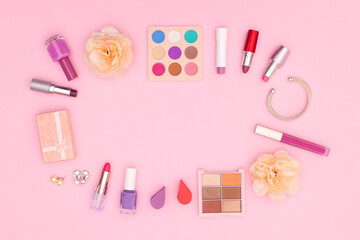 Obraz na płótnie Canvas Pastel make up products on pink theme 