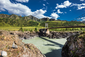 Mountain landscape with a bridge over the Katun river. Altai republic