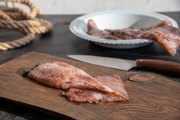 Sea food. The squid lies on a cutting board.