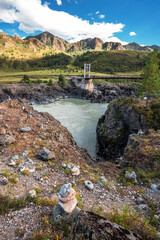 Mountain landscape with a bridge over the Katun river. altai republic