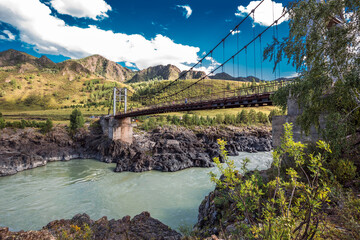 Mountain landscape with a bridge over the Katun river. Altai Republic