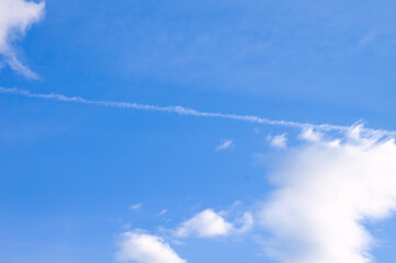 Naklejka na ściany i meble bright blue sky with vapor trail