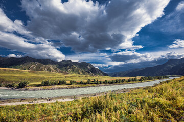 Mountain landscape with river and clouds. altai republic