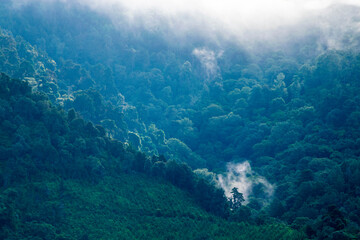 Fototapeta na wymiar Cloudy mountains in Guatemala Central America, panoramic view in the morning, source of oxygen and natural resources.