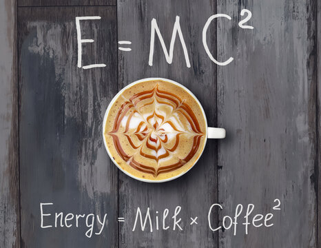 A cup of coffee with whipped cream is on a gray wooden desk with funny formulas.