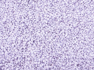 Texture background made of small stones toned purple. Used in gardening and landscape decoration.