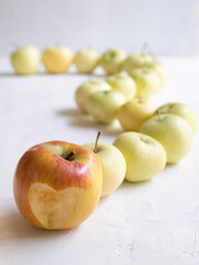 Solid background of green apples in a crate. Many organic Granny Smith apples. Healthy and affordable fruits in the supermarket, source of vitamin C. Pattern for design. View from above.