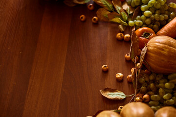 Autumn background with pumpkins and autumn fruits with copy space. Fall background with freshly picked vegetables and fruits after harvest. Thanksgiving