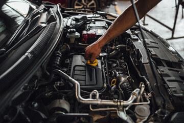 Fototapeta na wymiar Auto mechanic hands, car technical inspection in service