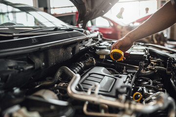 Auto mechanic hands, car technical inspection in service